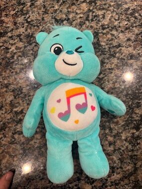 Turquoise Musical Plush Bear Stuffed Toy - Winking Bear with Music Note Belly